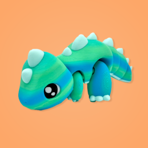 Colorful toy dinosaur with spikes on orange background