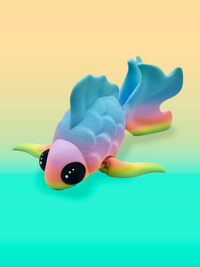Colorful toy fish on gradient background